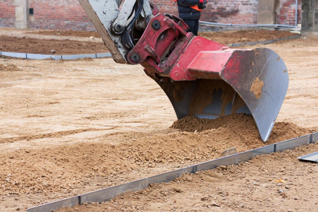 excavator scraping the soil