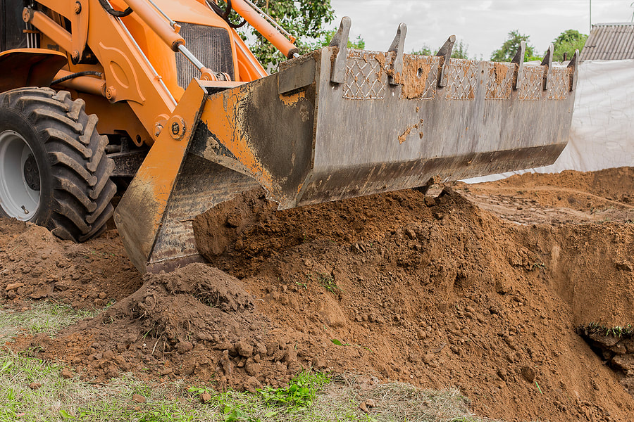 bulldozer scraping the soil